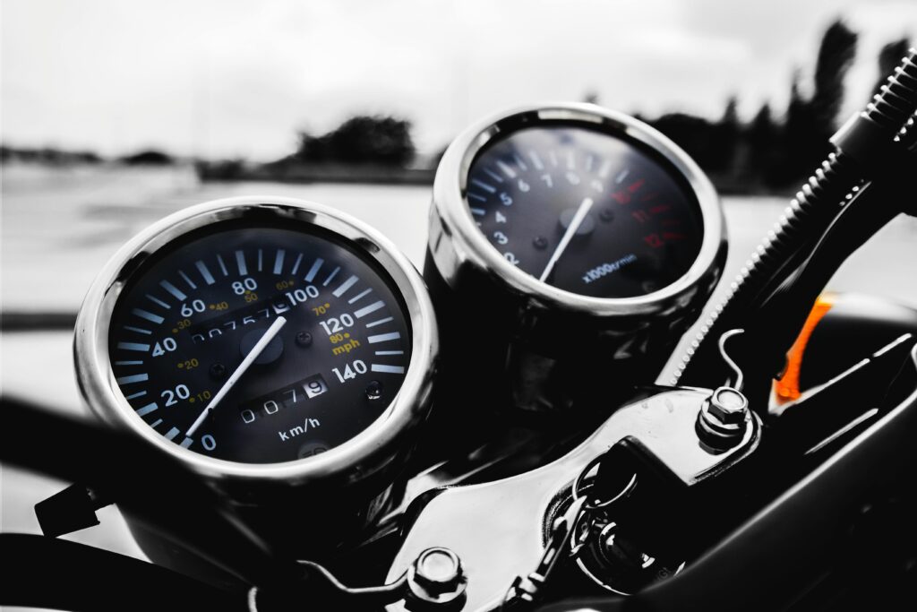 pexels-photo-115145-115145 Detailed shot of a motorcycle's speedometer and tachometer in focus, showcasing precision engineering.
